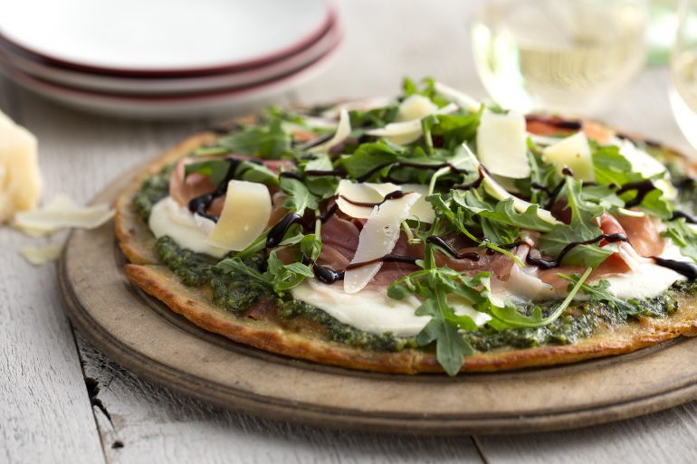 Pesto &amp; Arugula Cauliflower Prosciutto Pizza